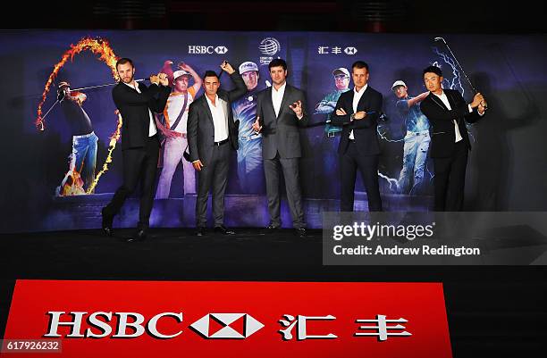 Golfers Dustin Johnson, Rickie Fowler and Bubba Watson of the United States, Henrik Stenson of Sweden and Haotong Li of China pose on stage at the...