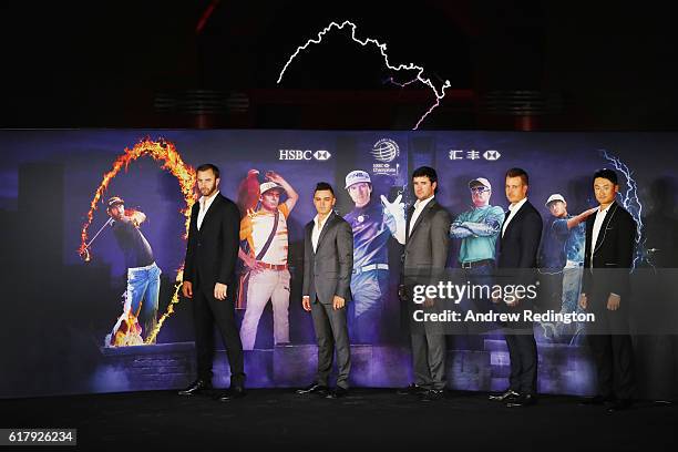 Golfers Dustin Johnson, Rickie Fowler and Bubba Watson of the United States, Henrik Stenson of Sweden and Haotong Li of China pose on stage at the...