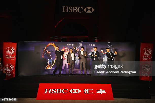 Golfers Dustin Johnson, Rickie Fowler and Bubba Watson of the United States, Henrik Stenson of Sweden and Haotong Li of China pose on stage at the...