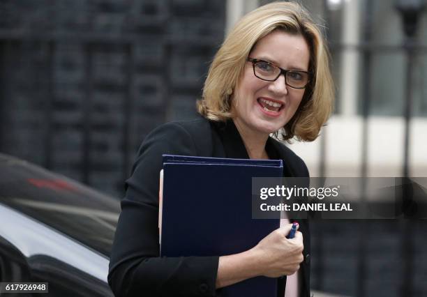 British Home Secretary Amber Rudd arrives for the weekly cabinet meeting at 10 Downing Street in London on October 25, 2016. - Britain has pledged up...