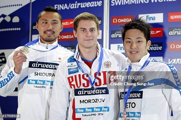 Shinri Shioura of Japan, Vladimir Morozov of Russia and Daiya Seto of Japan pose on the podium after the Men's 100m Individual Medley final during...