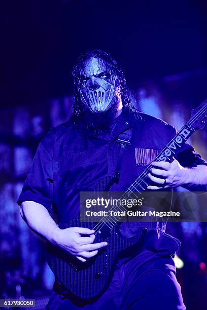 Portrait of American musician Mick Thompson, guitarist with heavy metal group Slipknot, performing live on stage at Motorpoint Arena in Cardiff on...