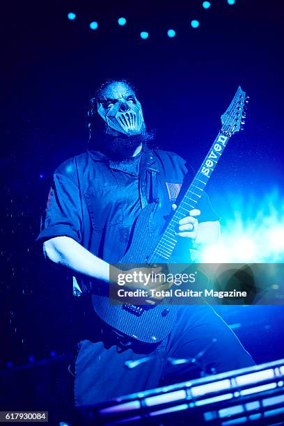 Portrait of American musician Mick Thompson, guitarist with heavy metal group Slipknot, performing live on stage at Motorpoint Arena in Cardiff on...