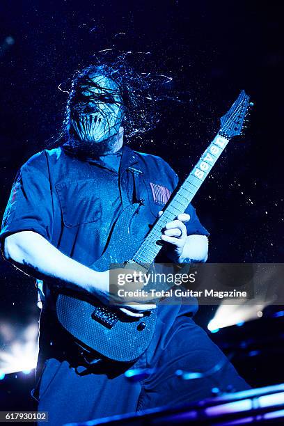 Portrait of American musician Mick Thompson, guitarist with heavy metal group Slipknot, performing live on stage at Motorpoint Arena in Cardiff on...