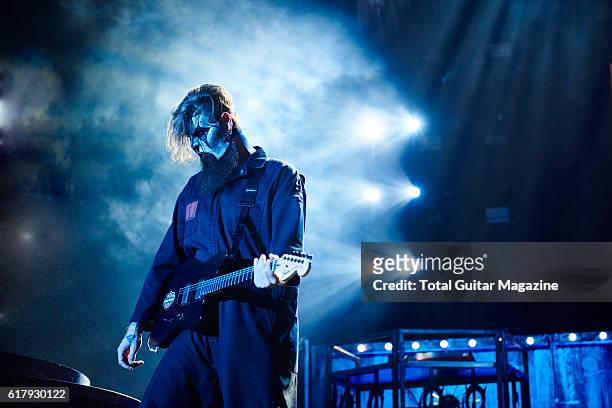 Portrait of American musician Jim Root, guitarist with heavy metal group Slipknot, performing live on stage at Motorpoint Arena in Cardiff on...
