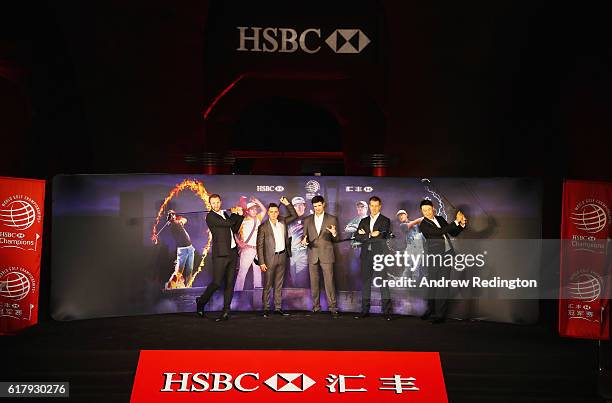 Golfers Dustin Johnson, Rickie Fowler and Bubba Watson of the United States, Henrik Stenson of Sweden and Haotong Li of China pose on stage at the...