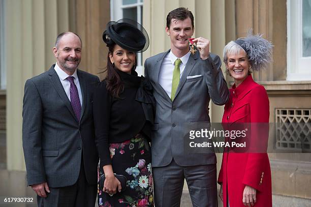 Jamie Murray with his wife Alejandra Gutierrez, mother Judy and father William after he received his Officer of the Order of the British Empire for...