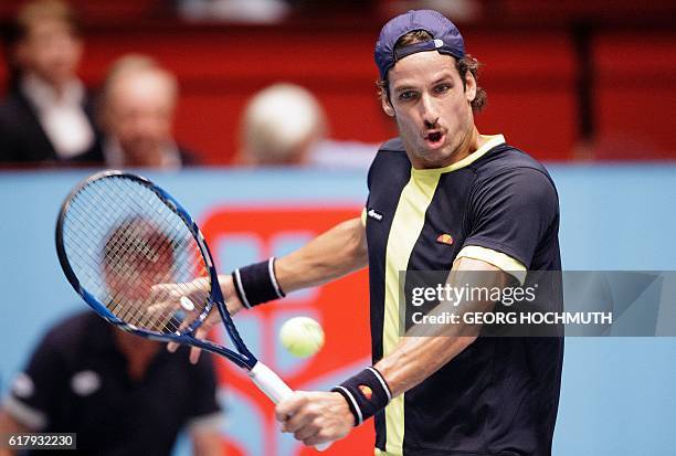 Feliciano Lopez of Spain in action against Lucas Pouille of France during their match of the Erste Bank Open ATP tennis tournament in Vienna,...