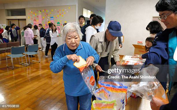 Meals are distrubuted at a day after magnitude 6.6 earthquake hit the area on October 22, 2016 in Hokuei, Tottori, Japan. More than 2,800 residents...