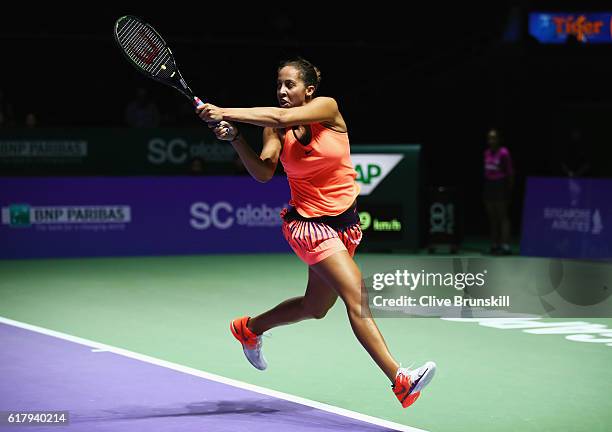 Madison Keys of the United States plays a backhand in her singles match against Dominika Cibulkova of Slovakia during day 3 of the BNP Paribas WTA...