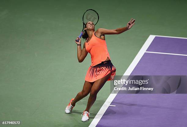 Madison Keys of the United States serves in her singles match against Dominika Cibulkova of Slovakia during day 3 of the BNP Paribas WTA Finals...