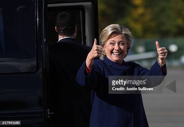 Democratic presidential nominee former Secretary of State Hillary Clinton give thumbs-up as she boards her campaign plane at Westchester County...