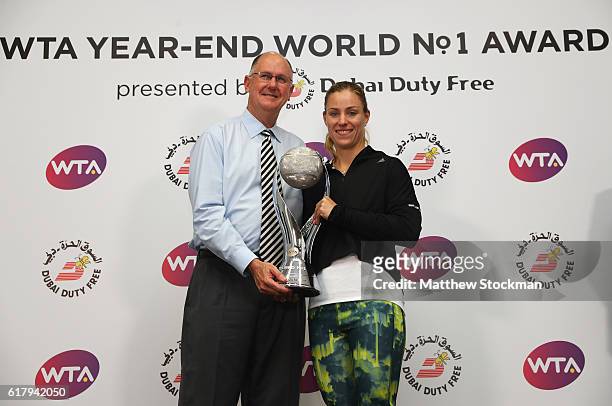 Steve Simon, WTA CEO poses with Angelique Kerber of Germany during the DDF Year-End World No.1 presentation during day 3 of the BNP Paribas WTA...