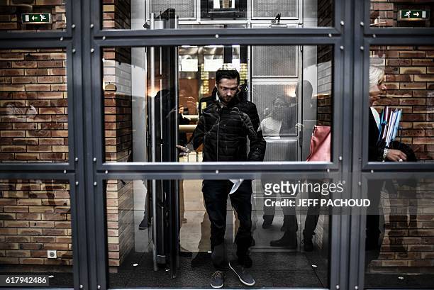 Man who was arrested for destroying hardware with a petanque ball in an Apple Store in Dijon, arrives for his trial at court in Dijon, eastern...
