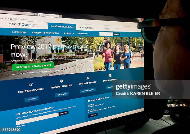 This October 25, 2016 photo shows a woman looking at the Healthcare.gov internet site in Washington, DC. Americans will see Obamacare health...