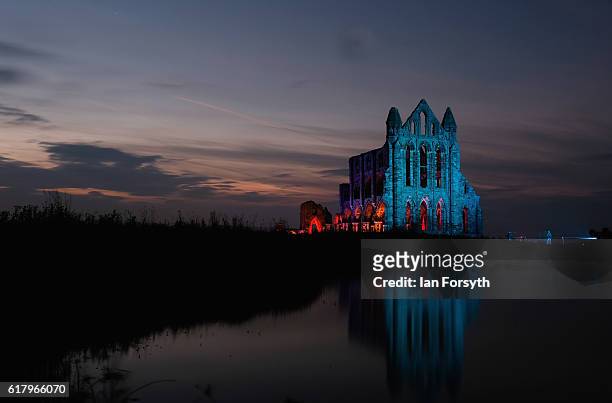 Spectacular light display illuminates the historic Whitby Abbey on October 25, 2016 in Whitby, United Kingdom. The famous Benedictine abbey will be...