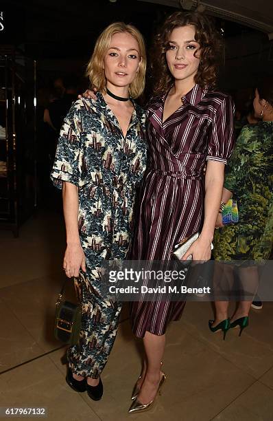 Clara Paget and Amber Anderson attend the Burberry BAFTA Breakthrough Brits at Burberry on October 25, 2016 in London, England.