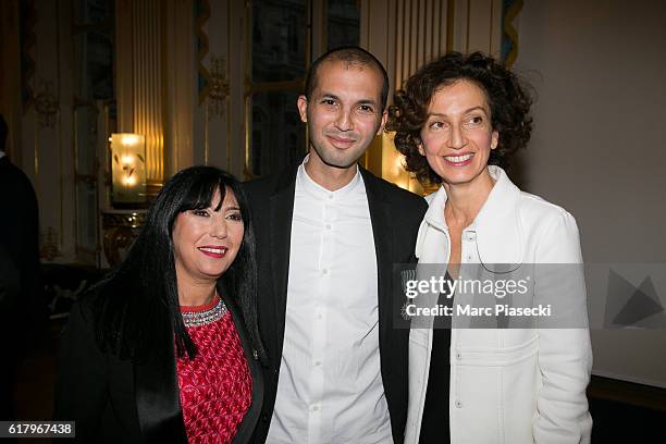 Musician Issam Krimi poses with Minister of Culture and Communication Audrey Azoulay as he receives the medal of 'Officer of Order of Arts and...