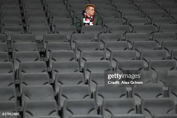 Fan of Frankfurt sits in the tribune prior to the DFB Cup Second Round match between Eintracht Frankfurt and FC Ingolstadt at Commerzbank-Arena on...