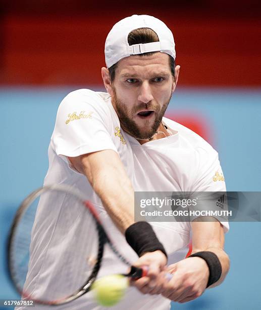 Austria's Juergen Melzer returns the ball to Spain's Roberto Bautista Agut during his match at the Erste Bank Open ATP tennis tournament in Vienna,...