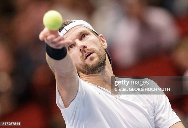 Austria's Juergen Melzer serves the ball to Spain's Roberto Bautista Agut during his match at the Erste Bank Open ATP tennis tournament in Vienna,...