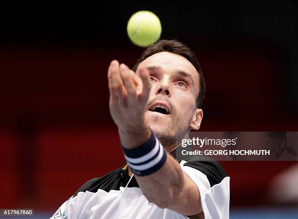 Spain's Roberto Bautista Agut serves the ball to Austria's Juergen Melzer during his match at the Erste Bank Open ATP tennis tournament in Vienna,...