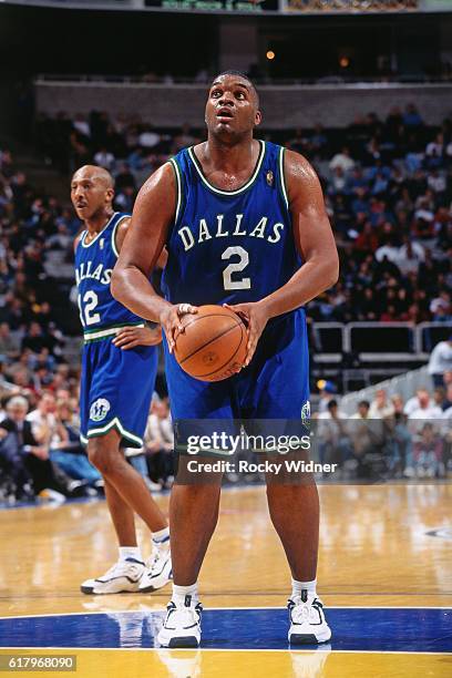 Oliver Miller of the Dallas Mavericks shoots against the Golden State Warriors circa 1996 at Oakland-Alameda County Coliseum Arena in Oakland,...