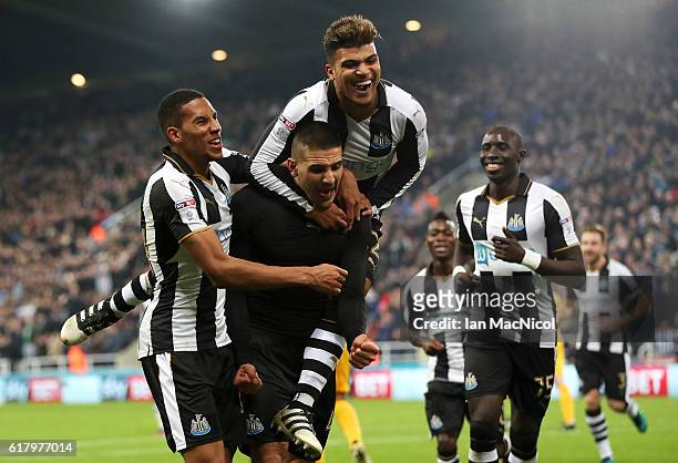 Aleksandar Mitrovic of Newcastle United celebrates scoring his sides fourth goal with his team mates during the EFL Cup fourth round match between...