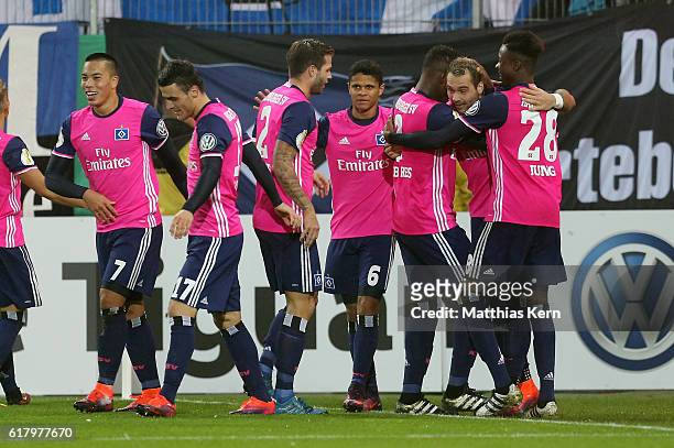 Pierre Michel Lasogga of Hamburg jubilates with team mates after scoring the third goal during the DFB Cup second round match between Hallescher FC...
