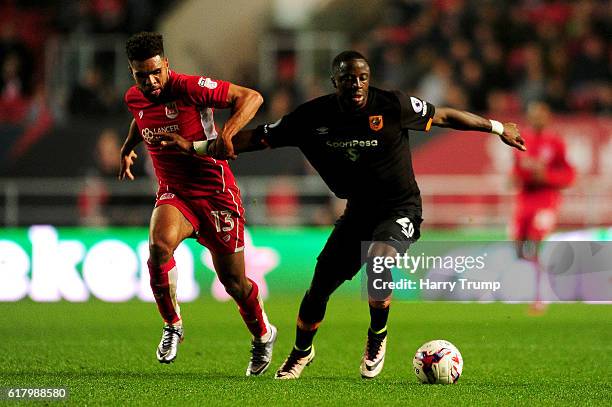 Scott Golbourne of Bristol City and Adama Diomande of Hull City battle for possession during the EFL Cup fourth round match between Bristol City and...