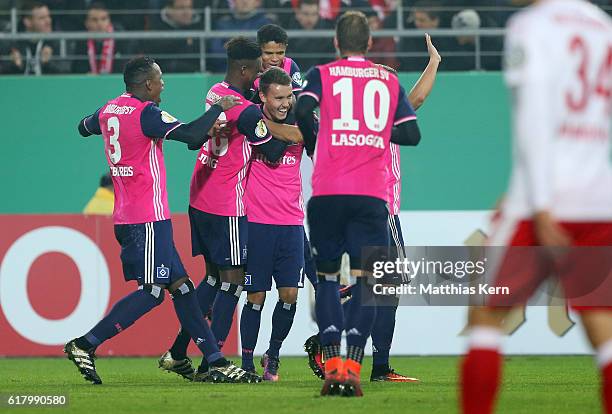 Luca Waldschmidt of Hamburg jubilates with team mates after scoring the fourth goal during the DFB Cup second round match between Hallescher FC and...