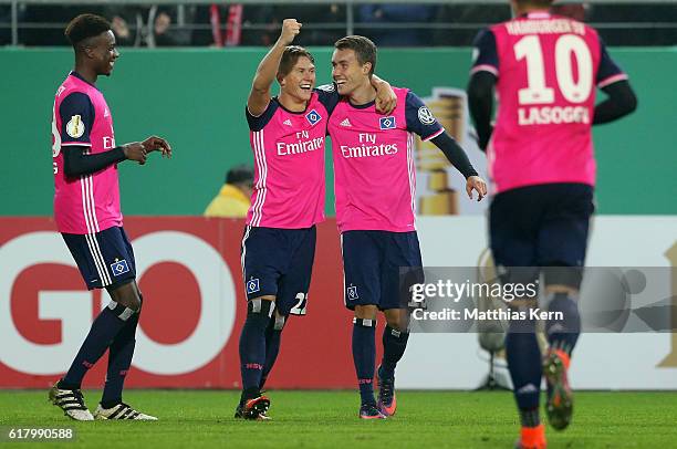 Luca Waldschmidt of Hamburg jubilates with team mates after scoring the fourth goal during the DFB Cup second round match between Hallescher FC and...