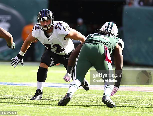 Alex Lewis of the Baltimore Ravens plays against Lorenzo Mauldin of the New York Jets during their game at MetLife Stadium on October 23, 2016 in...
