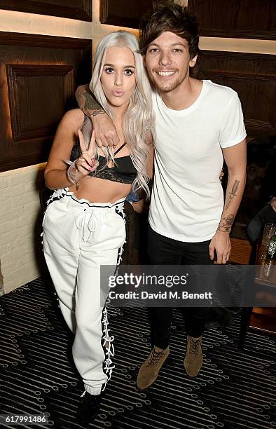 Lottie and Louis Tomlinson attend a party to launch her collection Nails Inc X Lips Inc Matchbox collection, at Tape London on October 25, 2016 in...