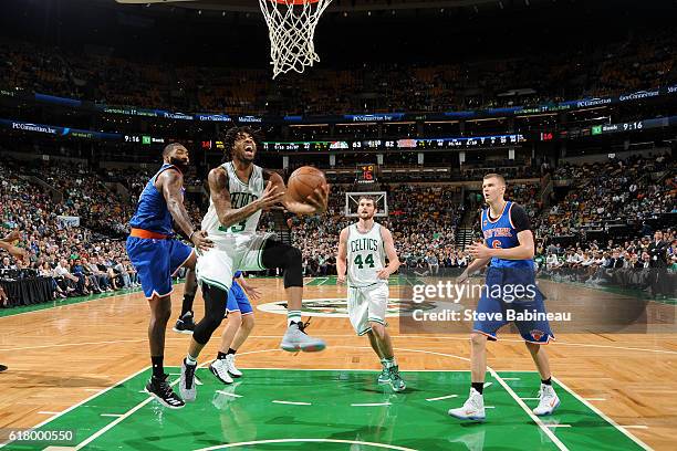 James Young of the Boston Celtics drives to the basket against the New York Knicks during an NBA preseason game on October 19, 2016 at the TD Garden...