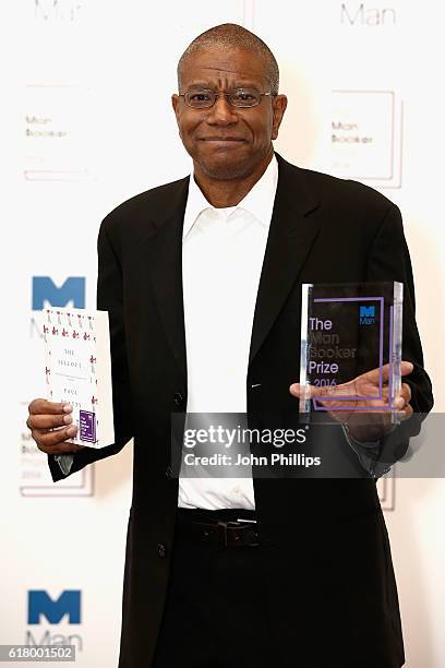 Winner of the 2016 Man Booker Prize Paul Beatty poses with his novel 'The Sellout' at the 2016 Man Booker Prize at The Guildhall on October 25, 2016...