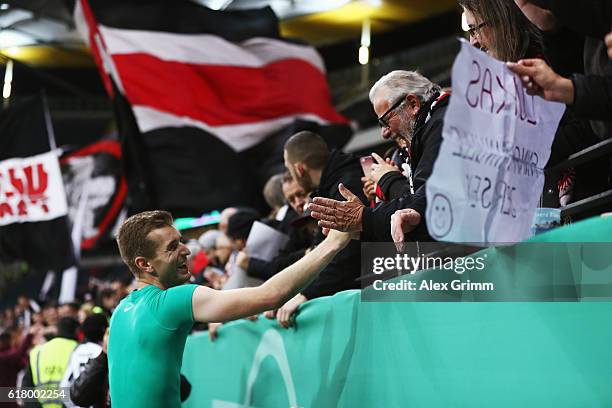 Goalkeeper Lukas Hradecky of Frankfurt celebrates wioth the fans after the DFB Cup Second Round match between Eintracht Frankfurt and FC Ingolstadt...