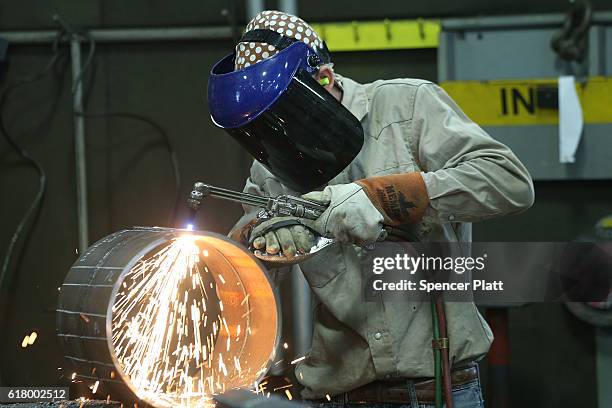 An employee welds pipe at Pioneer Pipe on October 25, 2016 in Marietta, Ohio. The construction, maintenance and fabrication company employs around...