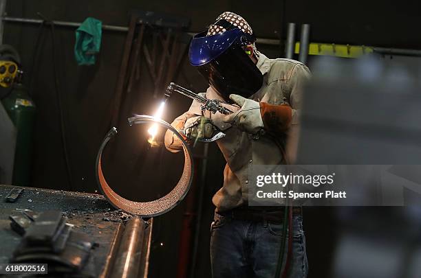 An employee welds pipe at Pioneer Pipe on October 25, 2016 in Marietta, Ohio. The construction, maintenance and fabrication company employs around...