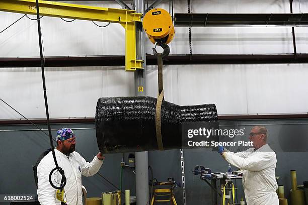 Employees work on building pipe at Pioneer Pipe on October 25, 2016 in Marietta, Ohio. The construction, maintenance and fabrication company employs...