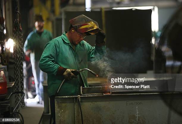 An employee welds pipe at Pioneer Pipe on October 25, 2016 in Marietta, Ohio. The construction, maintenance and fabrication company employs around...