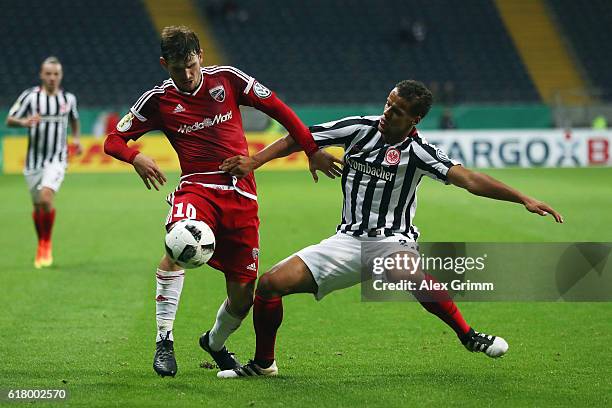 Timothy Chandler of Frankfurt is challenged by Pascal Gross of Ingolstadt during the DFB Cup Second Round match between Eintracht Frankfurt and FC...