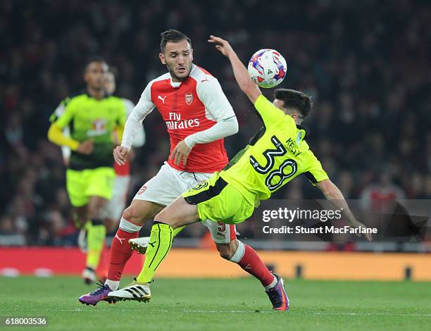 Lucas Perez of Arsenal challenged by Liam Kelly of Reading during the EFL Cup Fourth Round match between Arsenal and Reading at Emirates Stadium on...