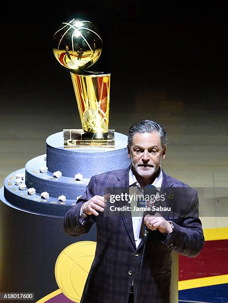 Cleveland Cavaliers owner Dan Gilbert speaks in front of the Larry O'Brien championship trophy before a game against the New York Knicks at Quicken...