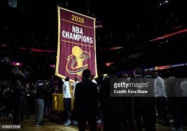 The Cleveland Cavaliers championship banner is raised before the game against the New York Knicks at Quicken Loans Arena on October 25, 2016 in...