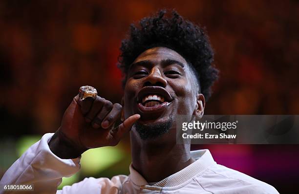 Iman Shumpert of the Cleveland Cavaliers shows his championship ring before the game against the New York Knicks at Quicken Loans Arena on October...