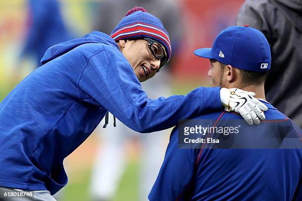 Munenori Kawasaki of the Chicago Cubs jokes around prior to Game One of the 2016 World Series against the Cleveland Indians at Progressive Field on...