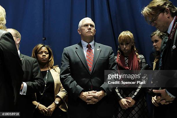 Republican Vice Presidential Candidate Mike Pence prays with his staff before taking the stage on October 25, 2016 in Marietta, Ohio. Ohio has become...