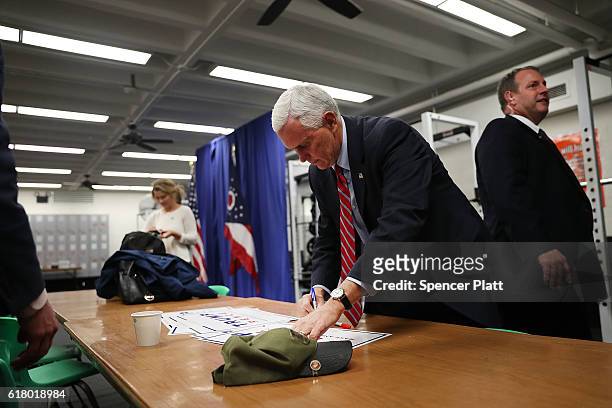 Republican Vice Presidential Candidate Mike Pence prepares to go on stage at a rally on October 25, 2016 in Marietta, Ohio. Ohio has become one of...