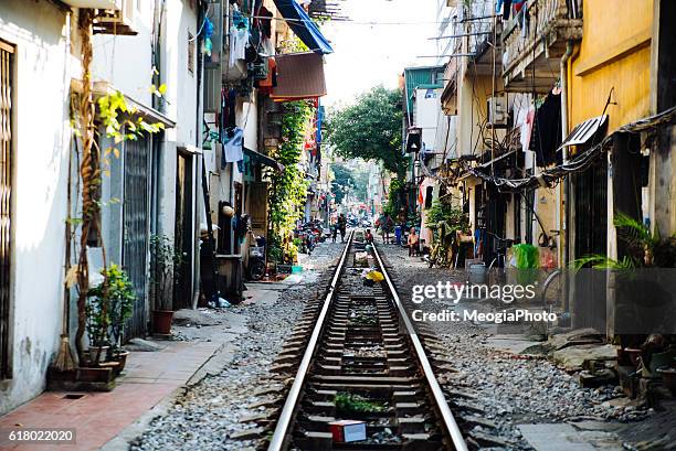 life of people who live near the railway in hanoi ancient town. - vietnam market stock pictures, royalty-free photos & images